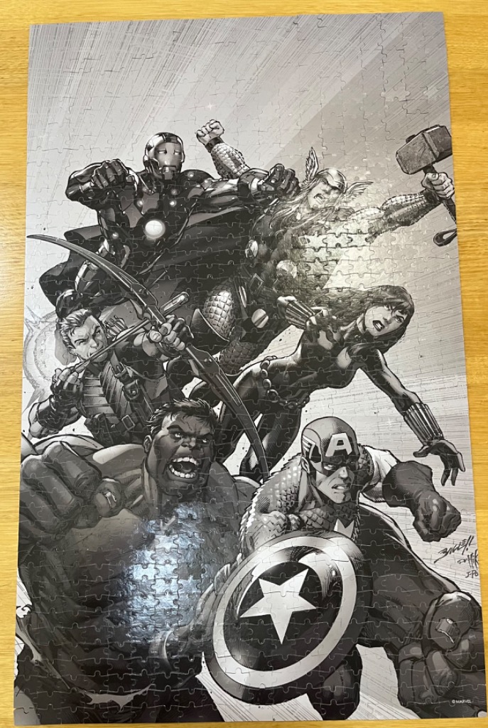 Black and white illustration of Marvel Avengers characters including Iron Man, Thor, Hulk, and Captain America.