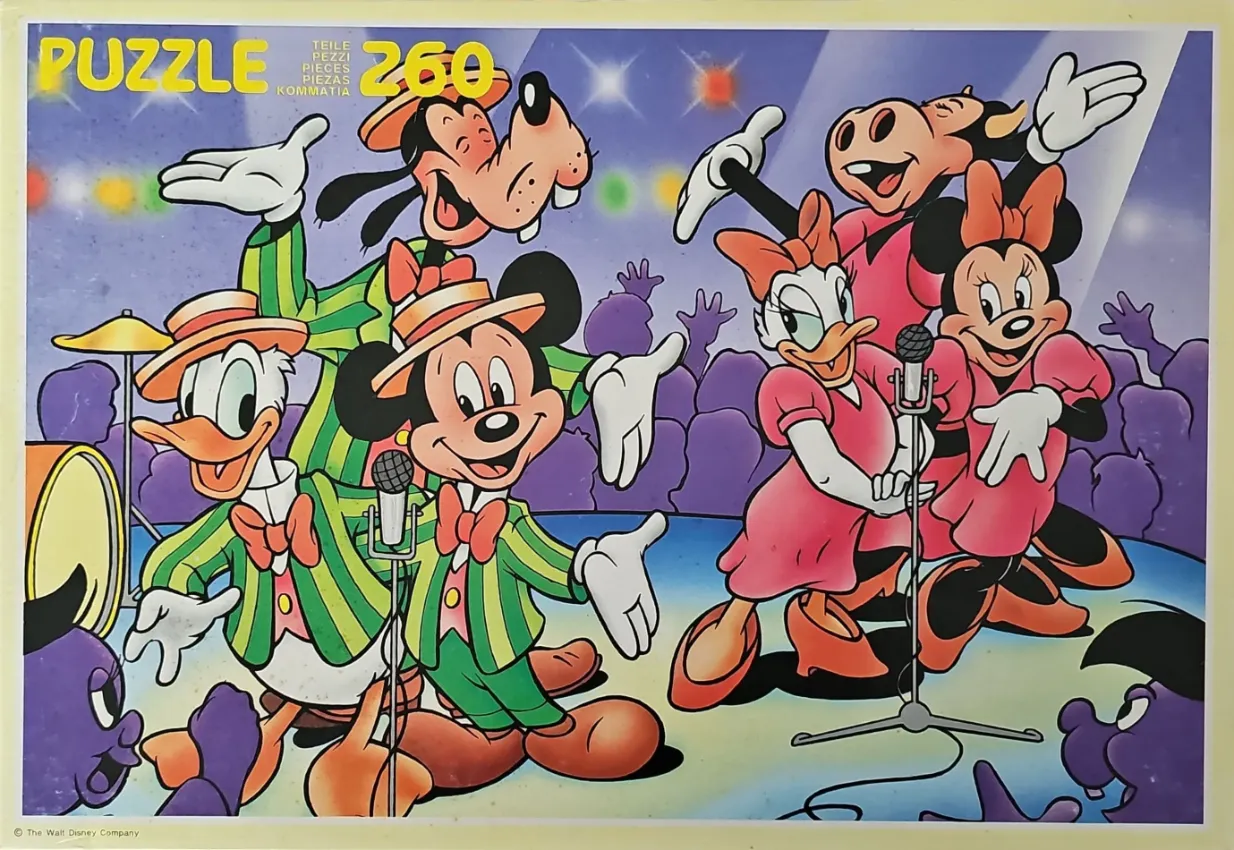 A lively illustration of cartoon characters performing on a stage with a cheering crowd.