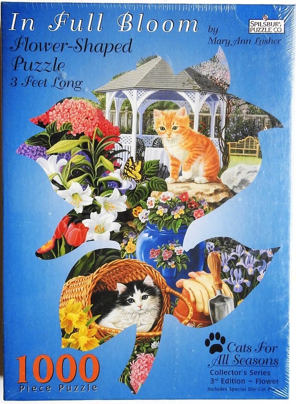 A floral-shaped collage featuring kittens, a garden gazebo, and vibrant flowers against a blue background.