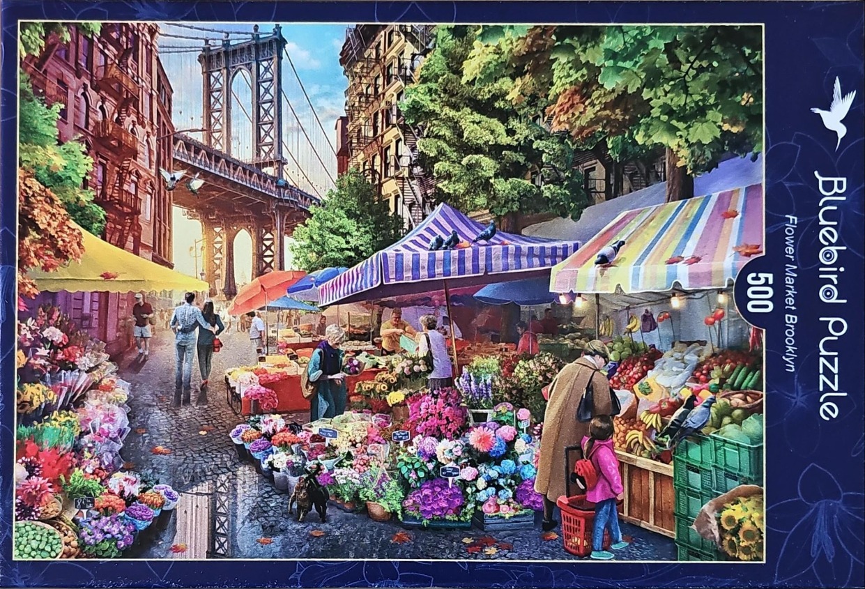 A street-level flower market in Brooklyn with the Manhattan Bridge in the background.