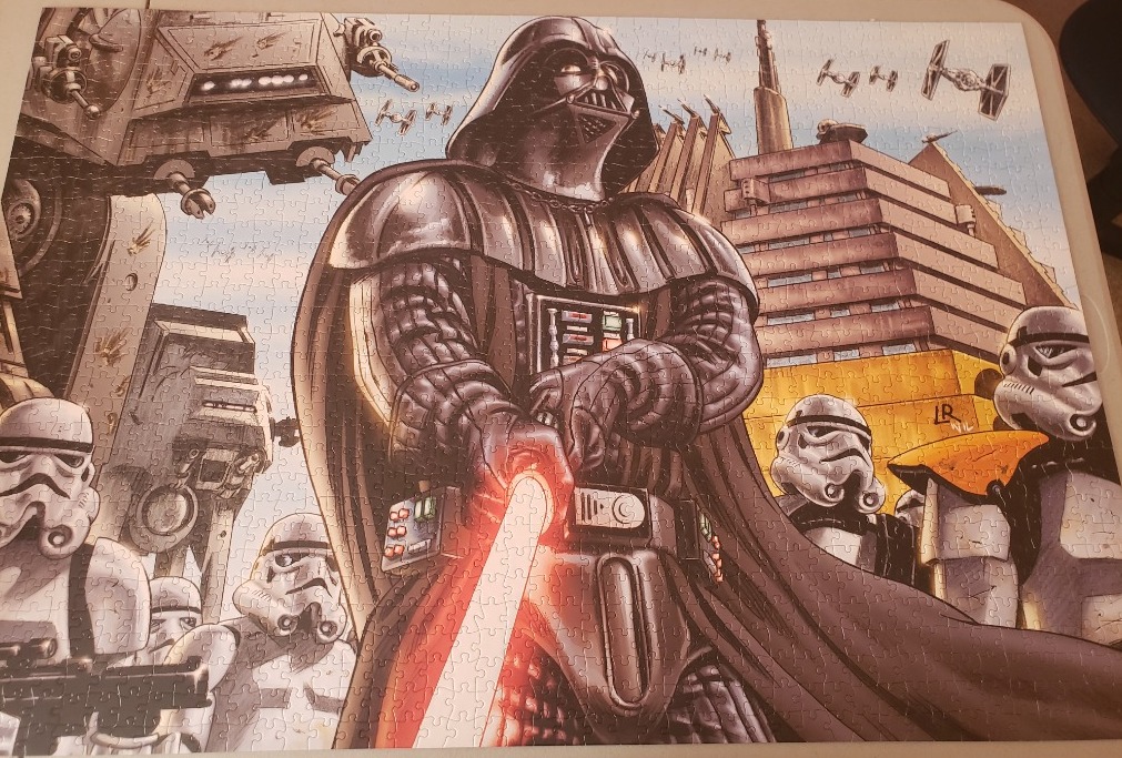 Darth Vader standing with stormtroopers, Imperial walkers, and a city background in an illustrated style.
