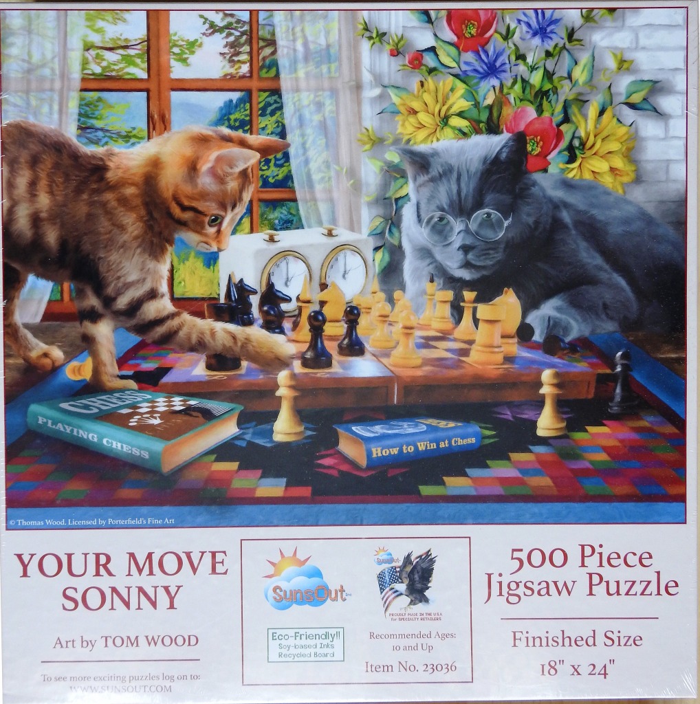 Two cats playing a game of chess in front of a window with a bouquet of flowers.