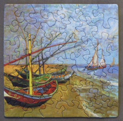 Oil painting of fishing boats on a sandy shore under a cloudy sky.