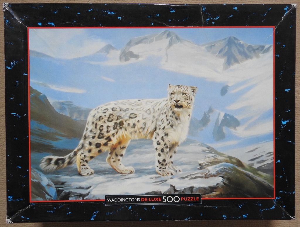 A painting of a snow leopard standing on a rocky, snow-covered mountain ledge against a backdrop of distant peaks.