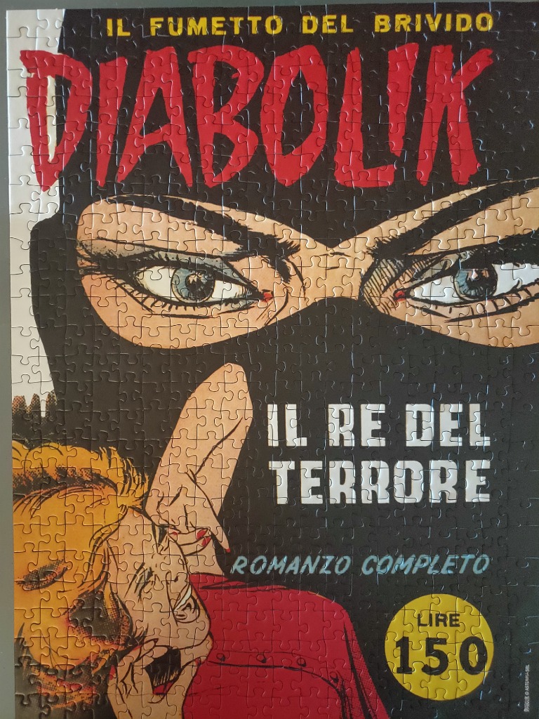 A vintage Italian Diabolik comic book cover featuring a masked man's intense eyes and a woman in the foreground.