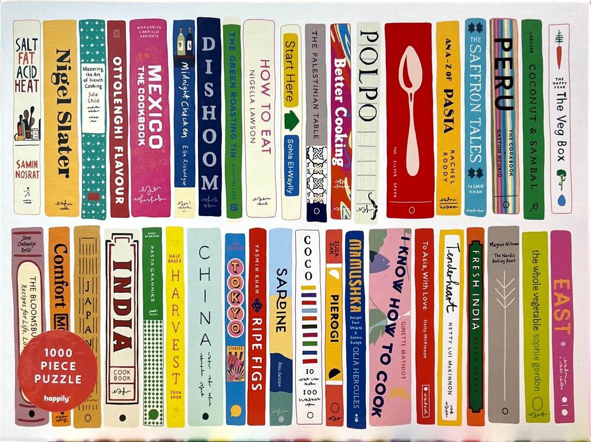 An illustration of two neat rows of colorful cookbook spines on a white background.