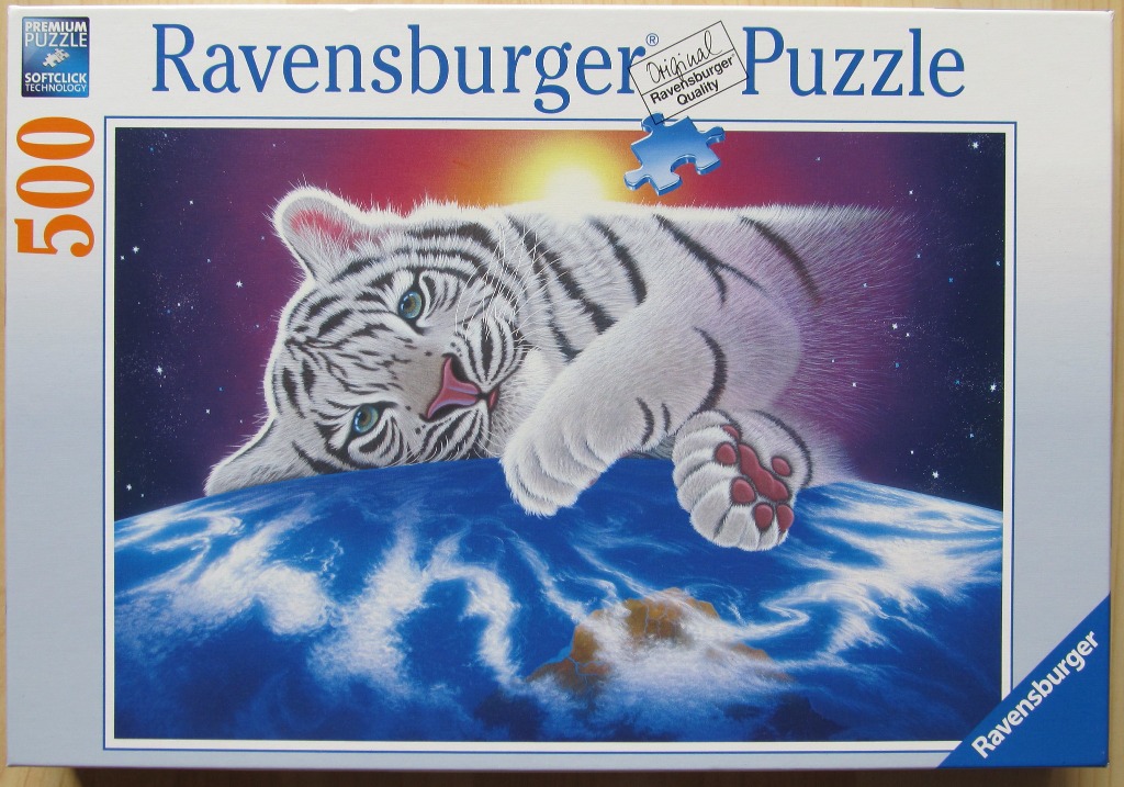 A white tiger cub lying across the Earth against a backdrop of a star-filled space scene.