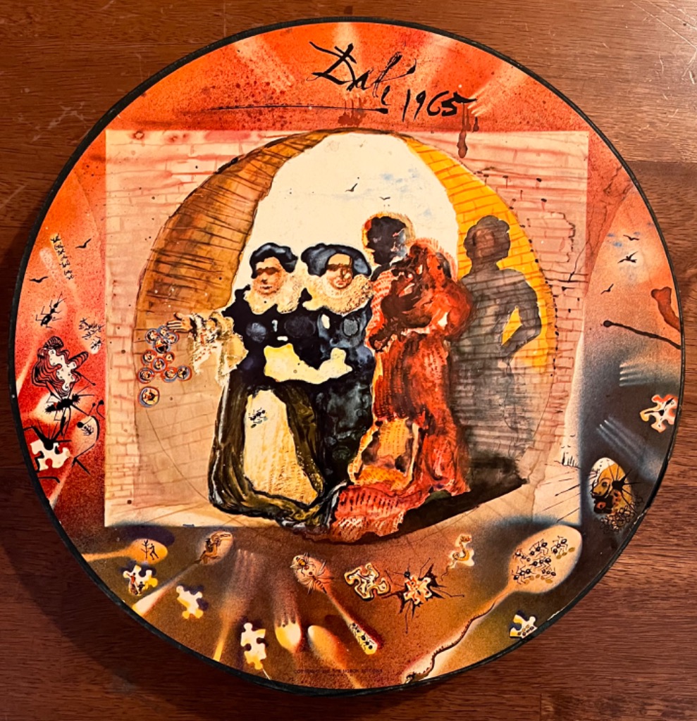 Surrealist circular painting depicting figures in period clothing with fragmented elements and ants on an orange backdrop.