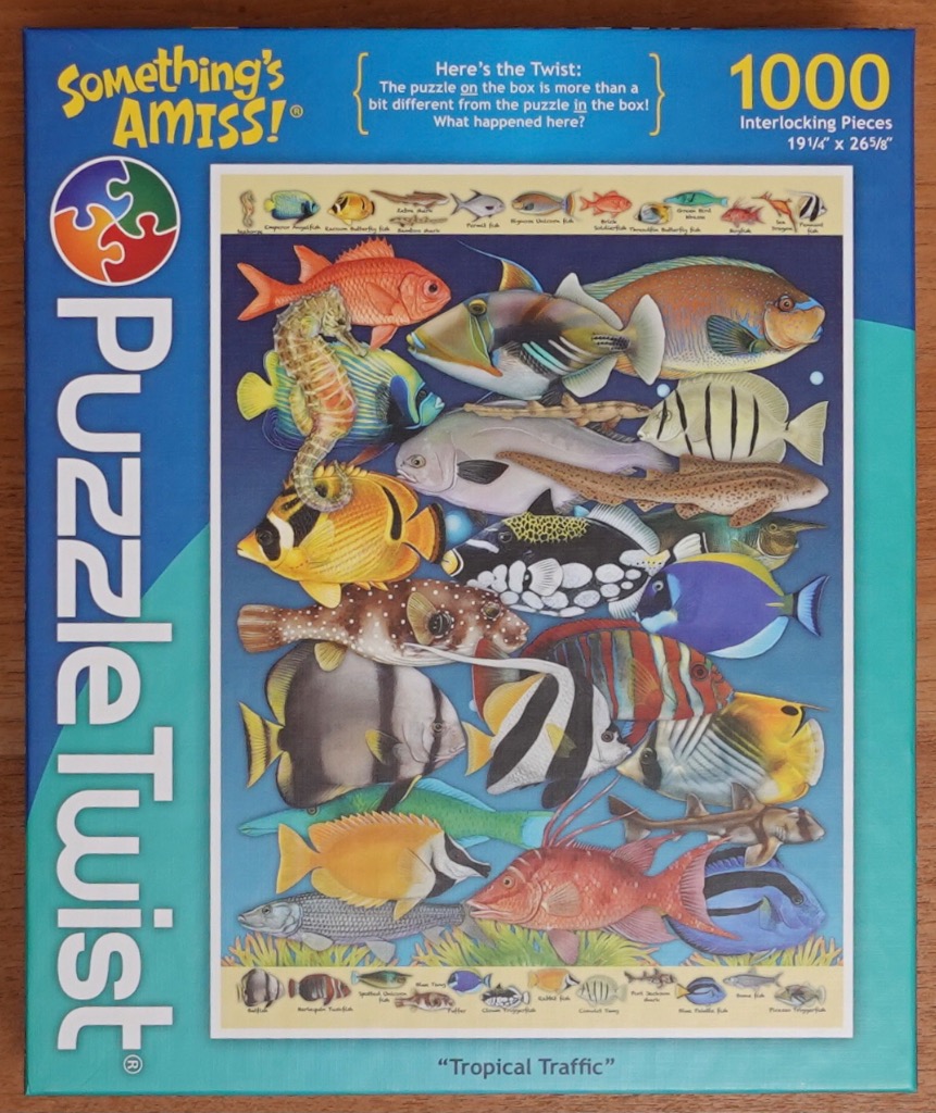 A collection of colorful tropical fish against a deep blue background.