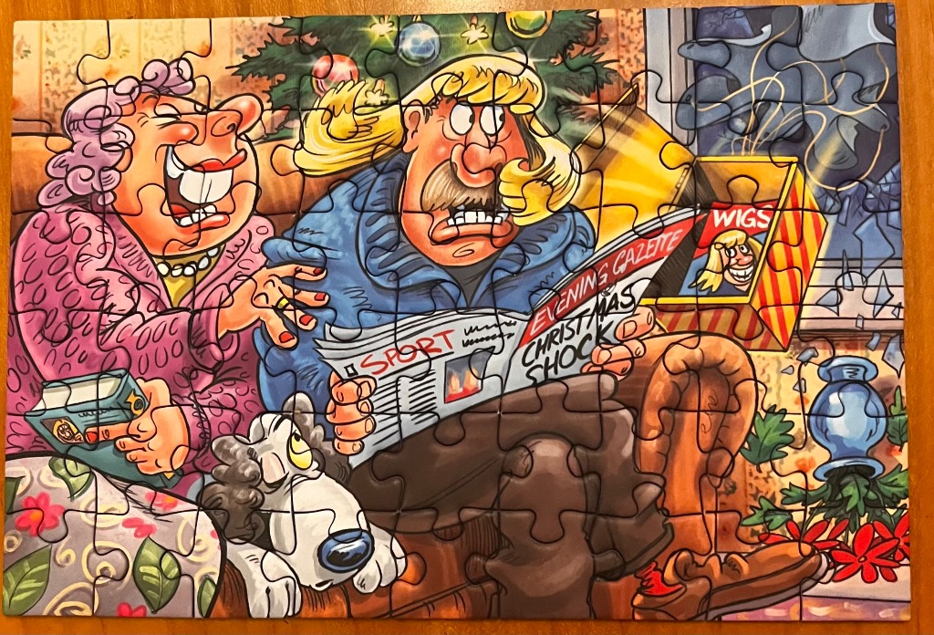 Cartoon of a shocked couple reading a Christmas newspaper with a dog and Christmas tree.