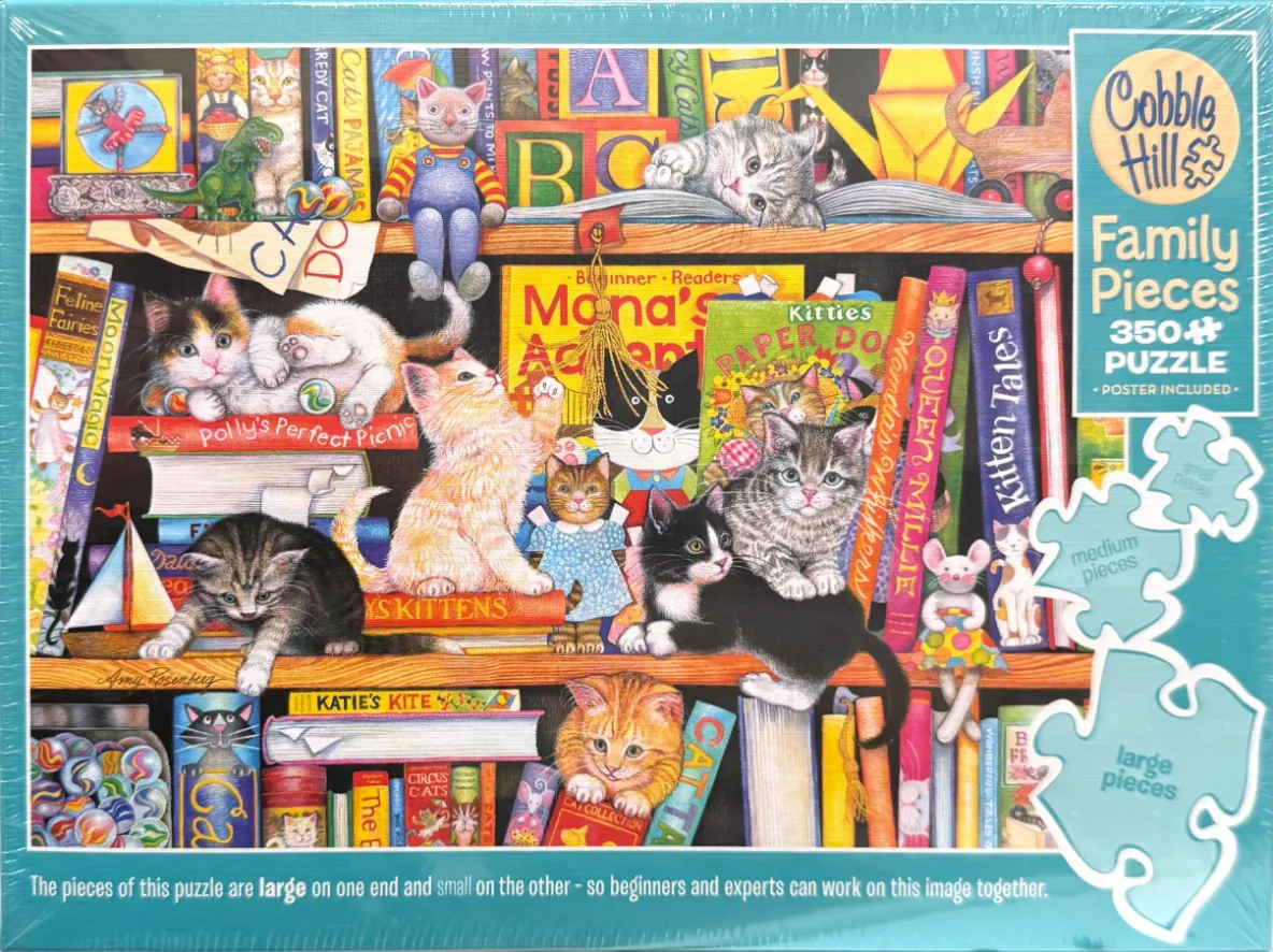 An illustration of many kittens playing on and around a wooden bookshelf filled with colorful books and toys.