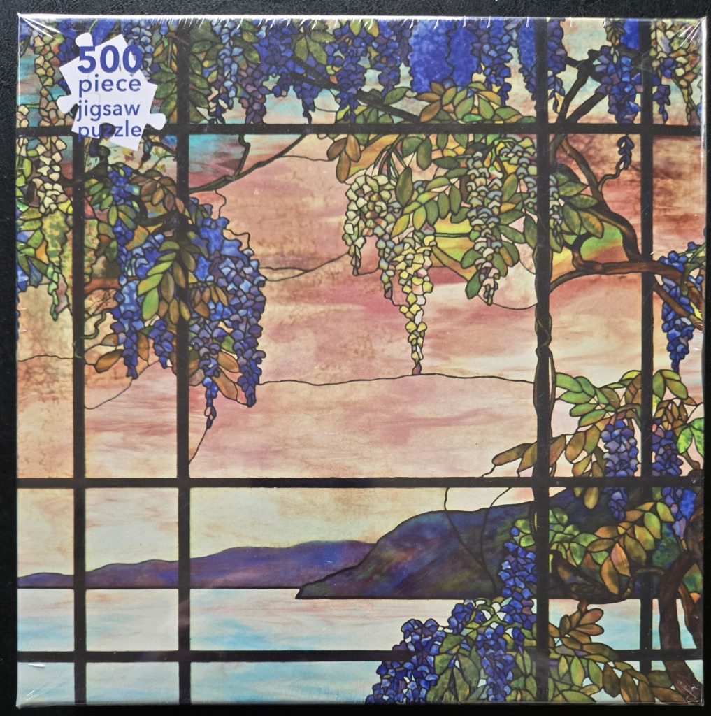 Stained glass style image of wisteria hanging over a sunset landscape with water and distant hills.