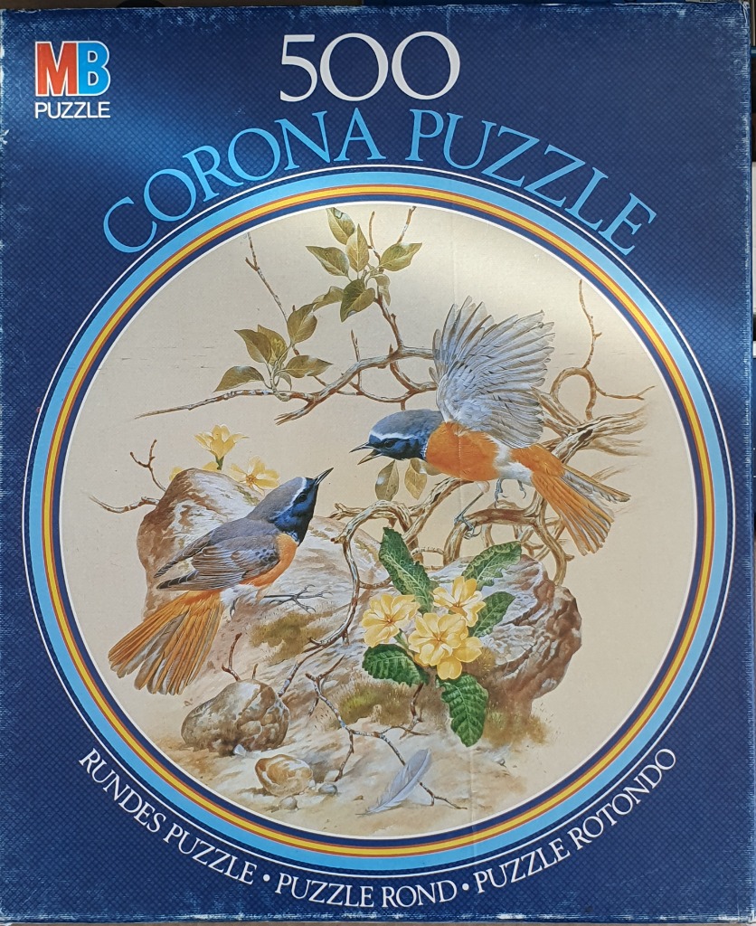 Painting of two orange and blue birds perched on rocks with yellow primrose flowers in a circular frame.