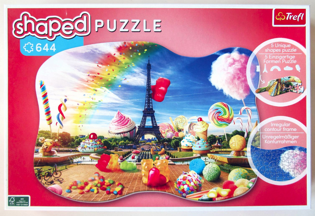A whimsical Parisian scene featuring the Eiffel Tower surrounded by giant sweets and candies under a rainbow sky.