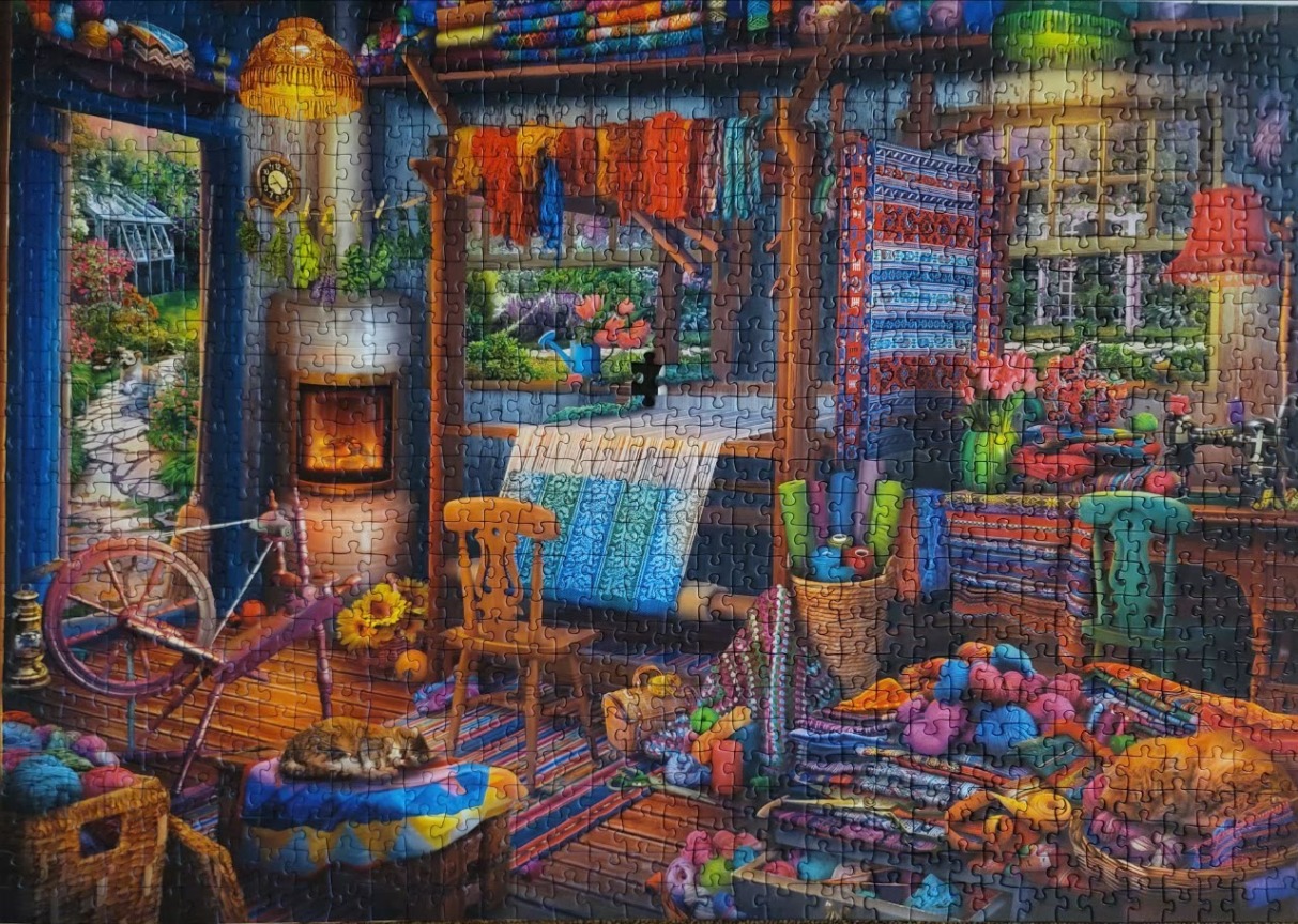 A cozy, vibrant weaver's studio filled with looms, yarn, and a sleeping cat, overlooking a lush garden.