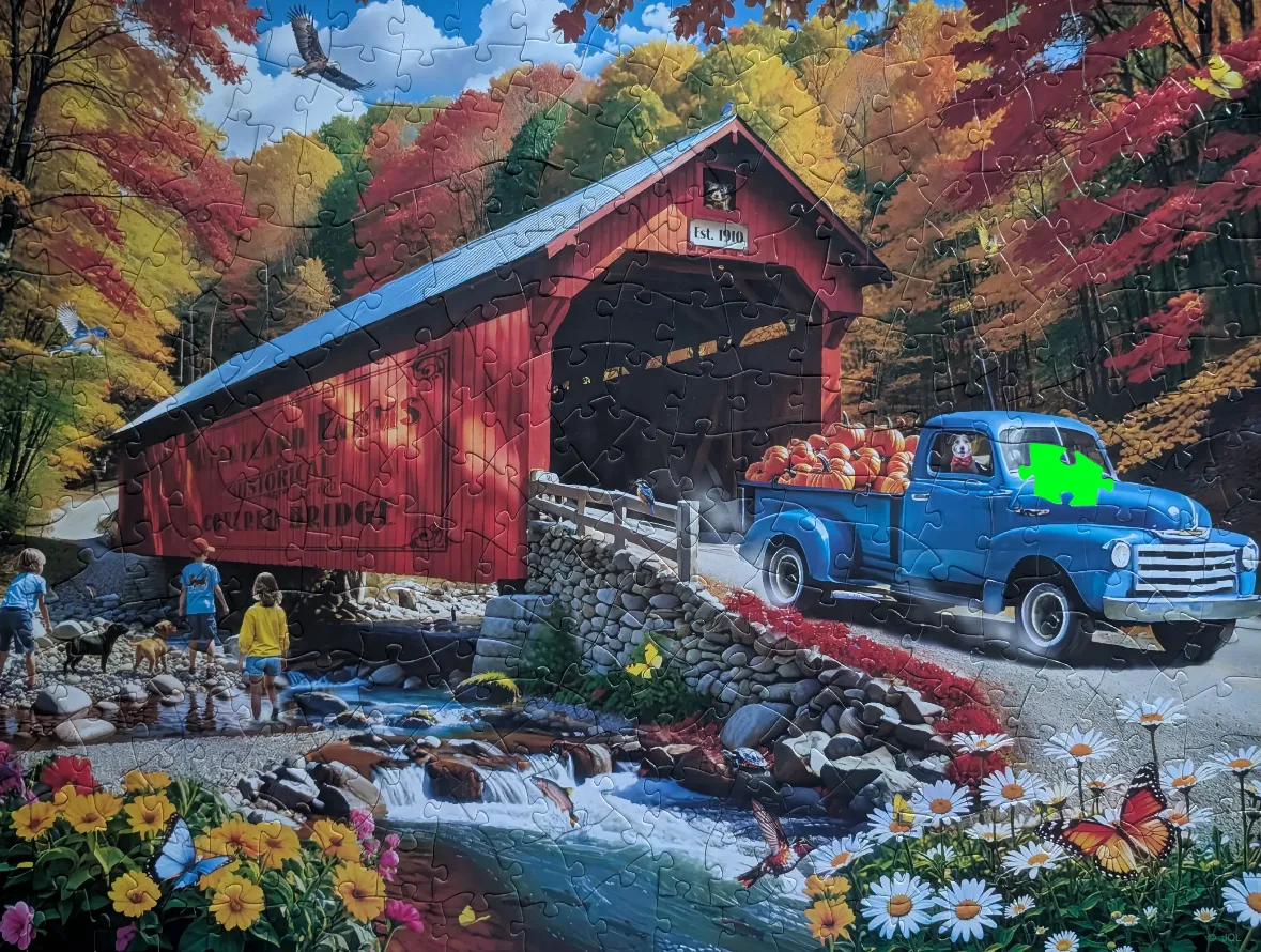 An autumn scene featuring a red covered bridge, a blue pickup truck full of pumpkins, and a creek with children.