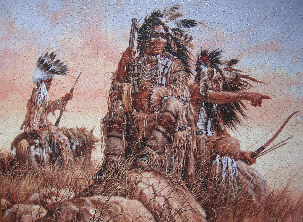 Three Native American warriors on a hillside at sunset, one mounted on a horse and two on foot holding weapons.