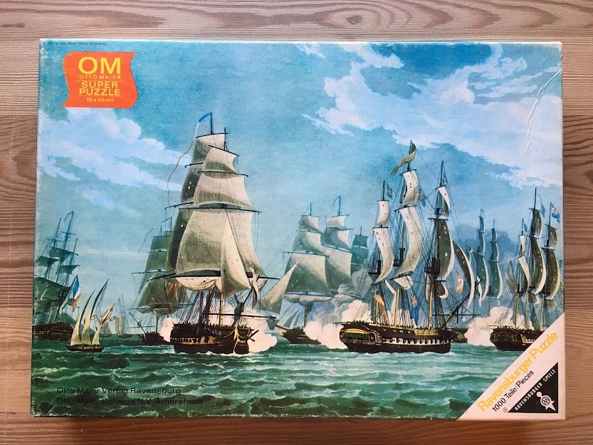 Painting of a fleet of tall ships under full sail on a choppy sea.