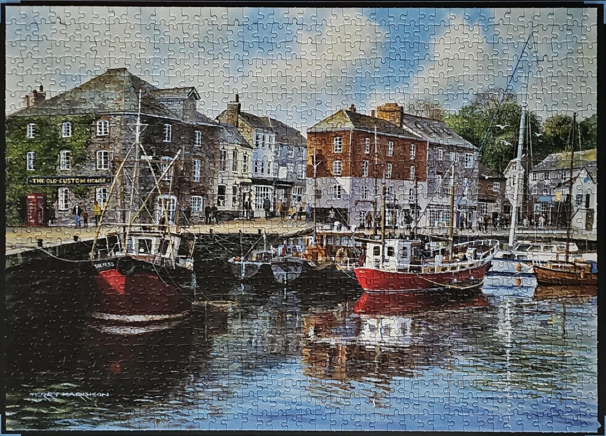 A painting of a harbor scene with fishing boats moored in front of historic stone buildings.