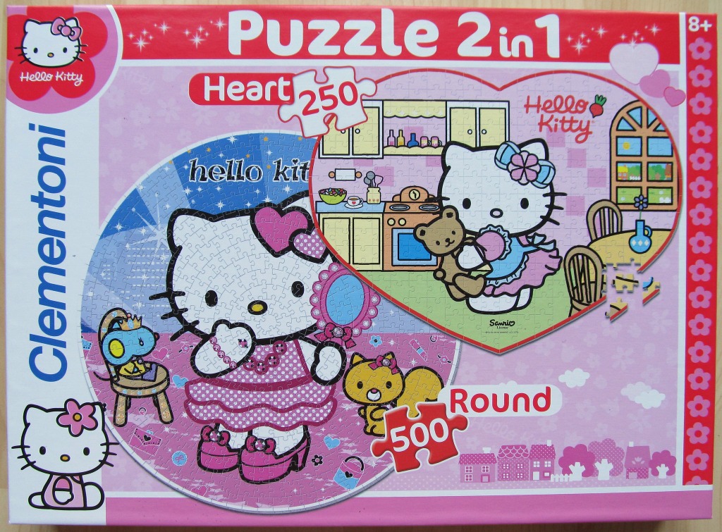 Two Hello Kitty scenes, one round and one heart-shaped, featuring Hello Kitty in various settings and outfits.