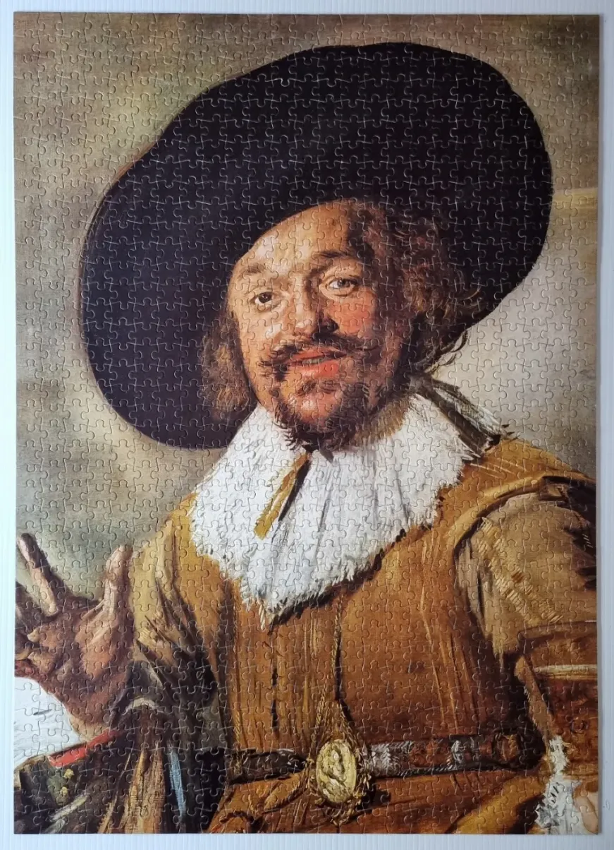 A portrait of Frans Hals' The Laughing Cavalier, a man with a moustache wearing a wide hat and ornate collar.
