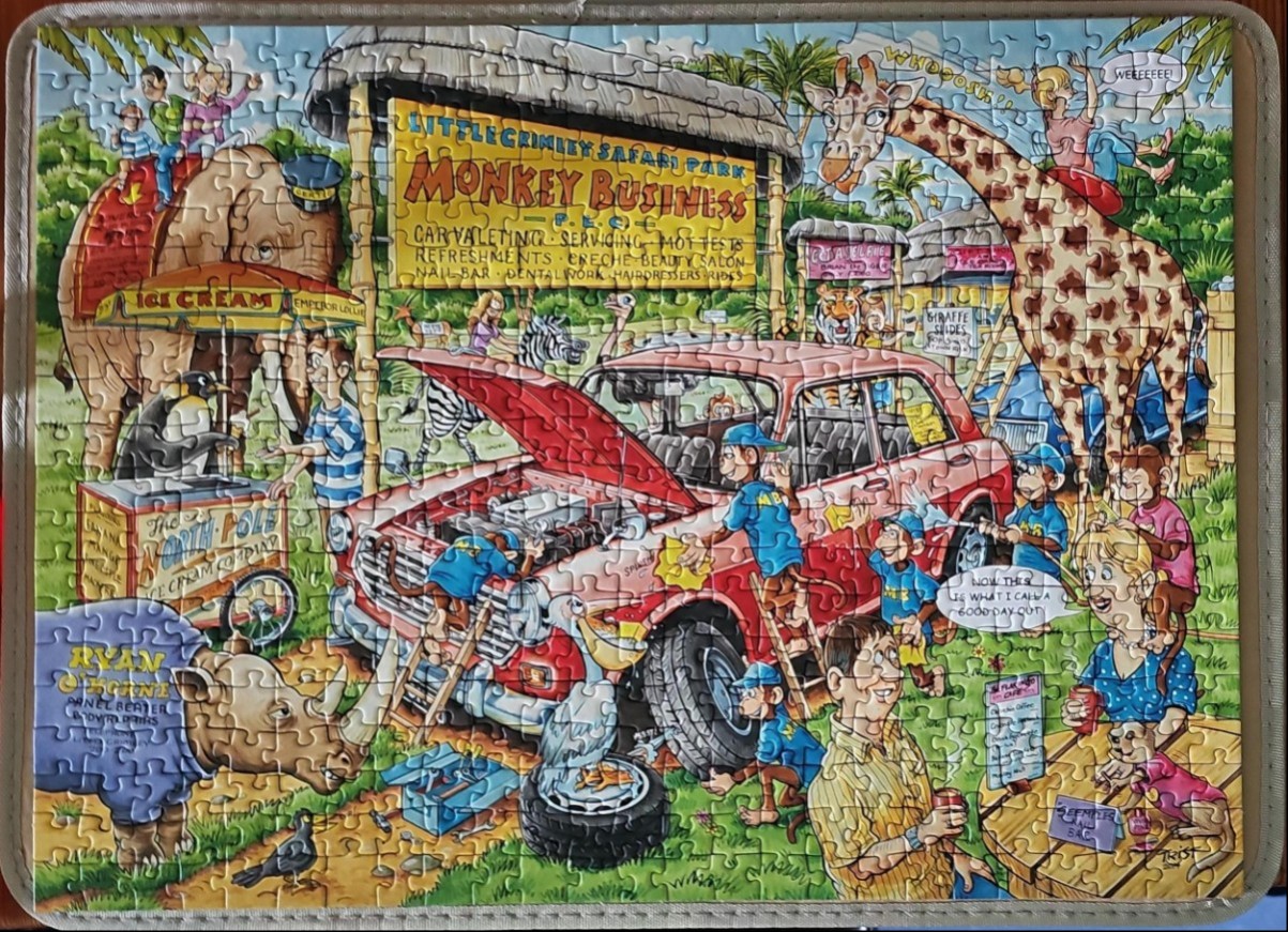 Cartoon safari scene with monkeys fixing a red car, a giraffe, elephant, and ice cream stand.