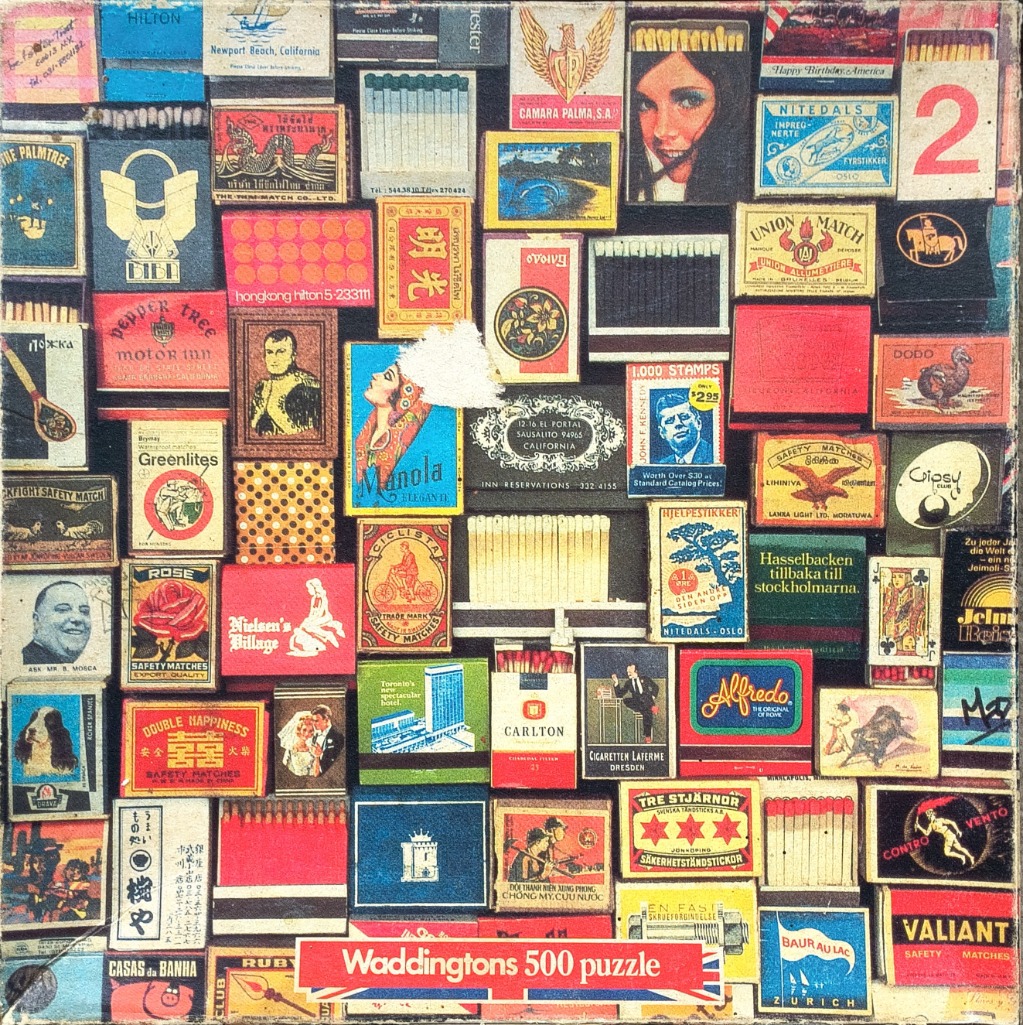 A collage of vintage matchbox labels from around the world featuring diverse graphics and typography.