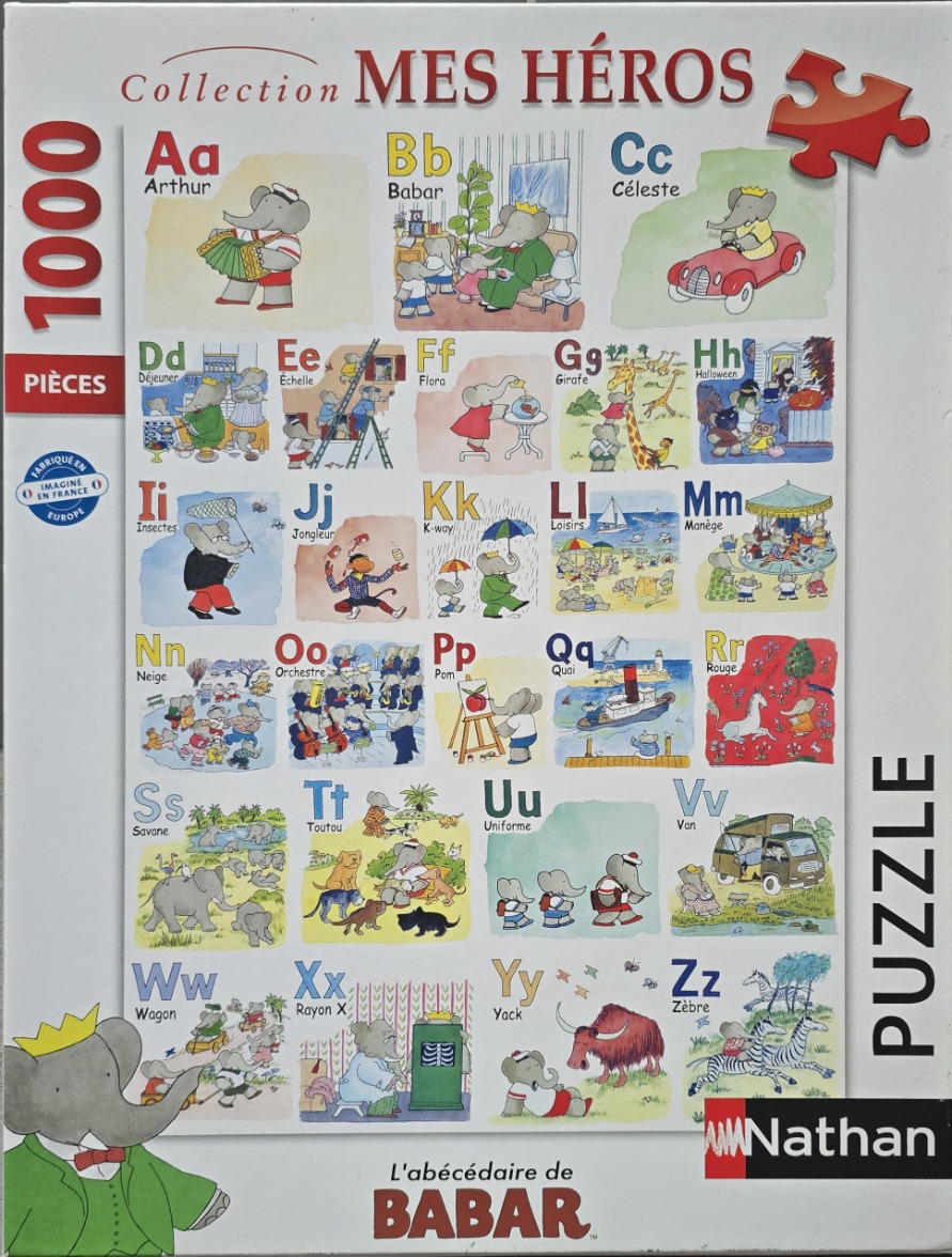 An alphabet poster featuring Babar the elephant and friends in various scenes for each letter.