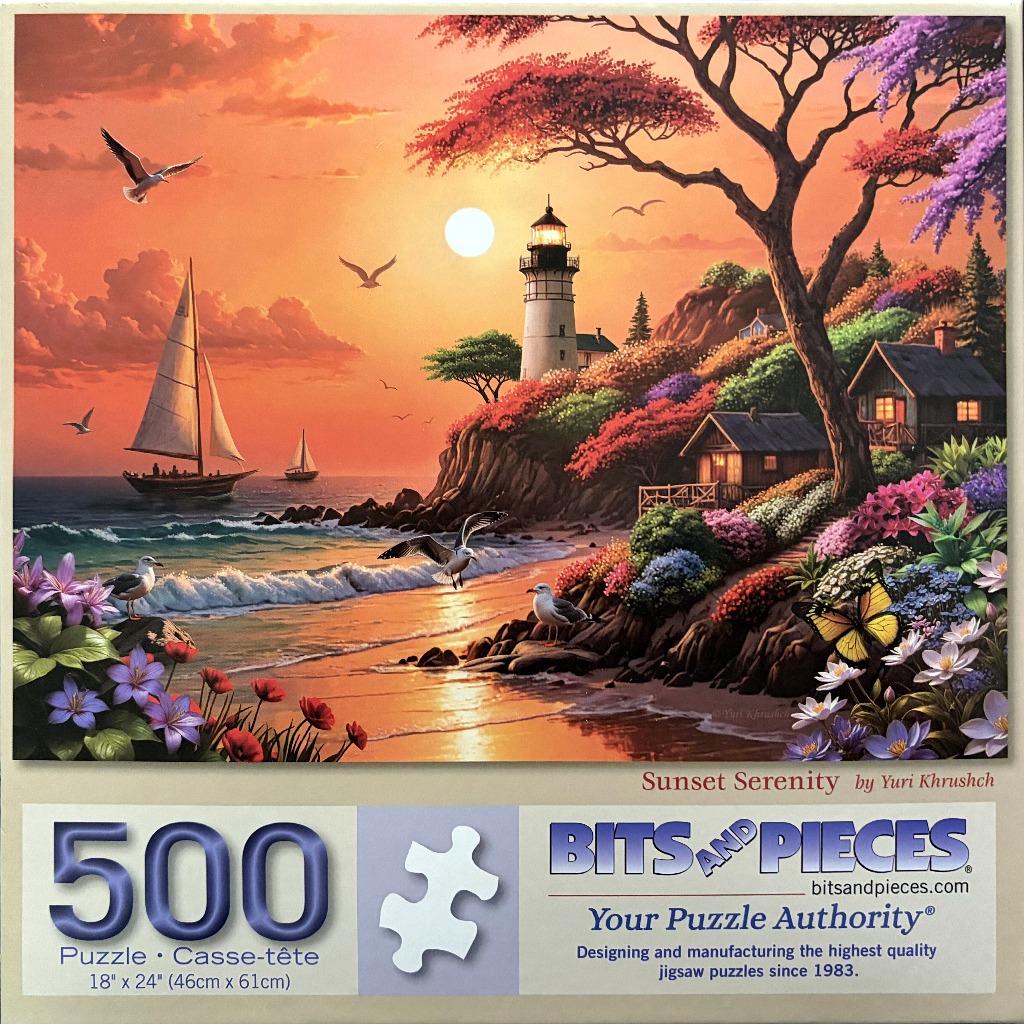 Lighthouse on a cliff overlooking a beach at sunset with a sailboat on the water.