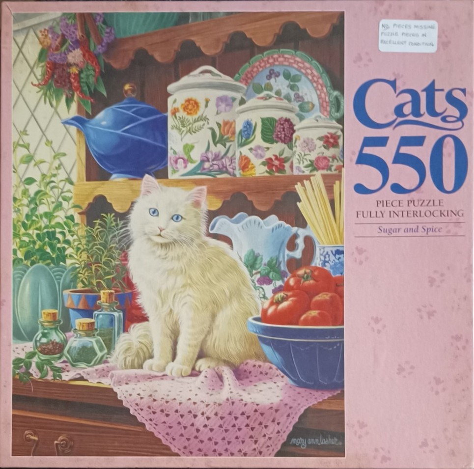 A white long-haired cat sitting on a kitchen counter filled with herbs, pottery, and produce.