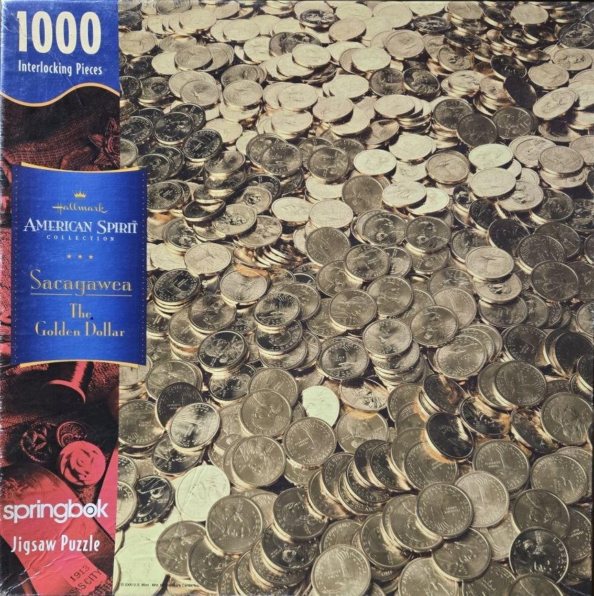 A close-up photograph of a large, overlapping pile of golden Sacagawea dollar coins.