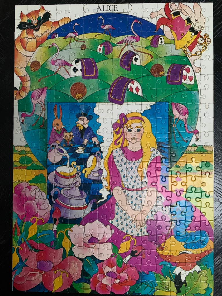 An illustration of Alice in Wonderland featuring tea party characters, flamingos, and vibrant floral patterns.