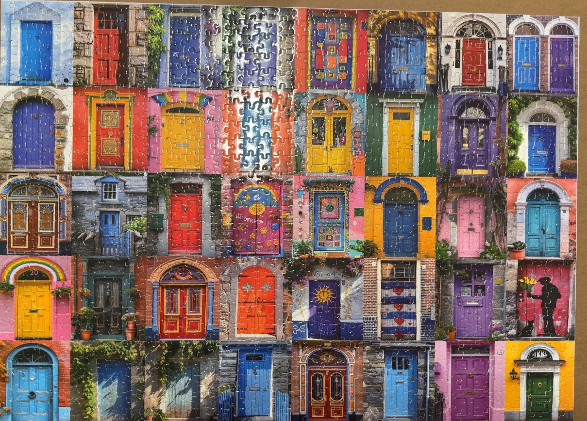 A collage of 42 colorful, unique front doors arranged in a grid pattern.