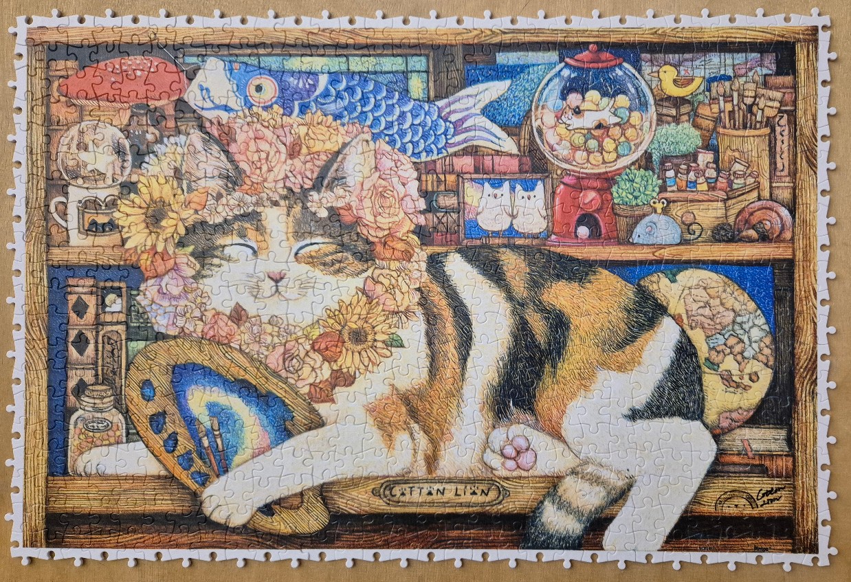 A whimsical illustration of a calico cat wearing a flower crown, lounging in a cozy, art-filled workshop.