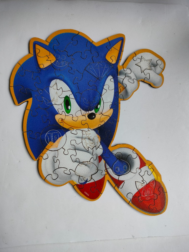 Shaped illustration of Sonic the Hedgehog featuring doodle-style icons on his blue fur