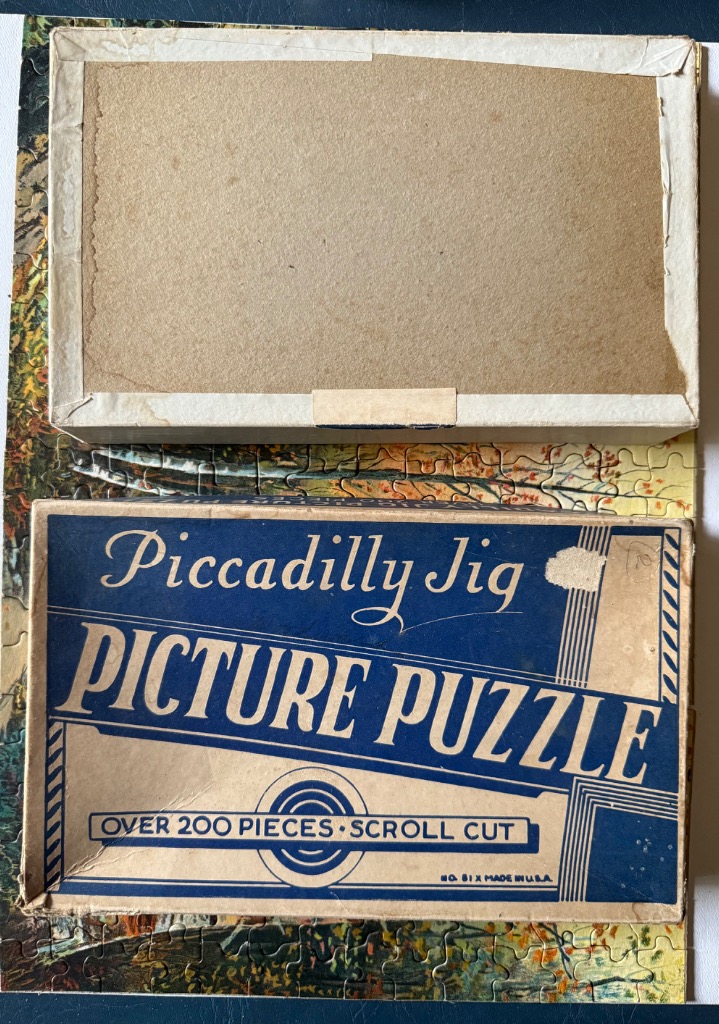 Graphic design on a vintage rectangular box featuring bold typography on a blue and cream background.