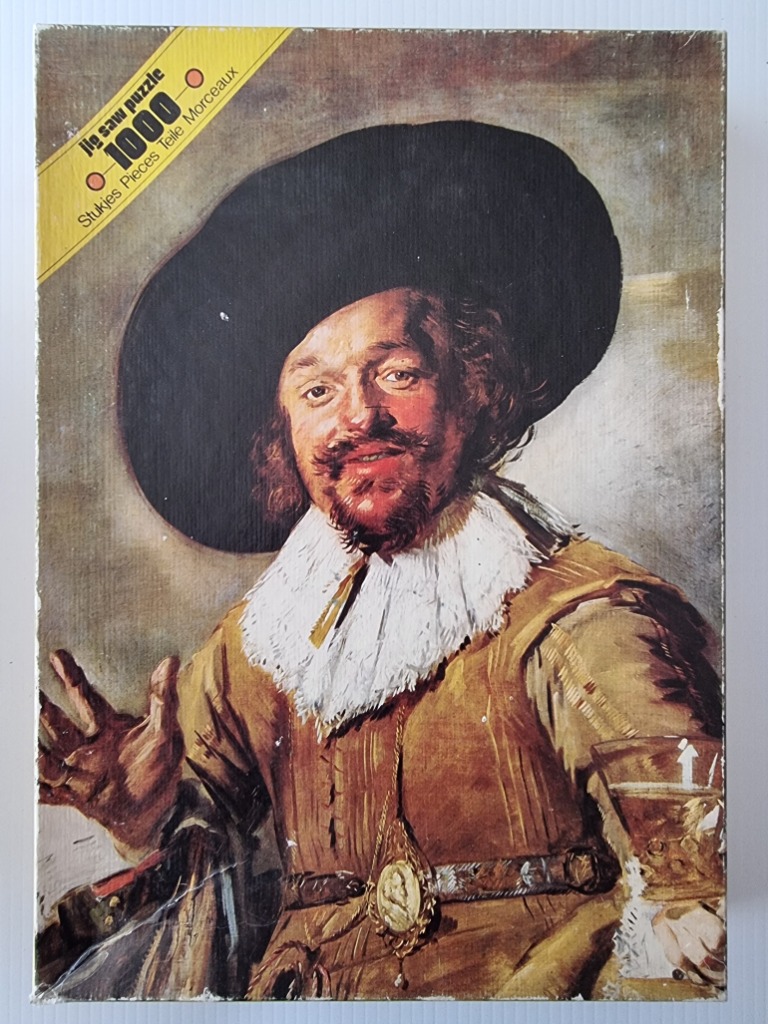 A 17th-century style oil painting of a smiling man in a wide-brimmed hat holding a glass.