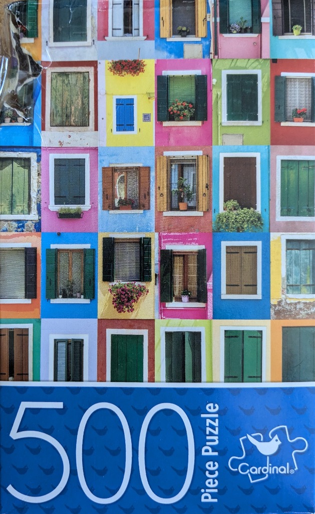 A collage of colourful windows on vibrant buildings in Burano, Italy