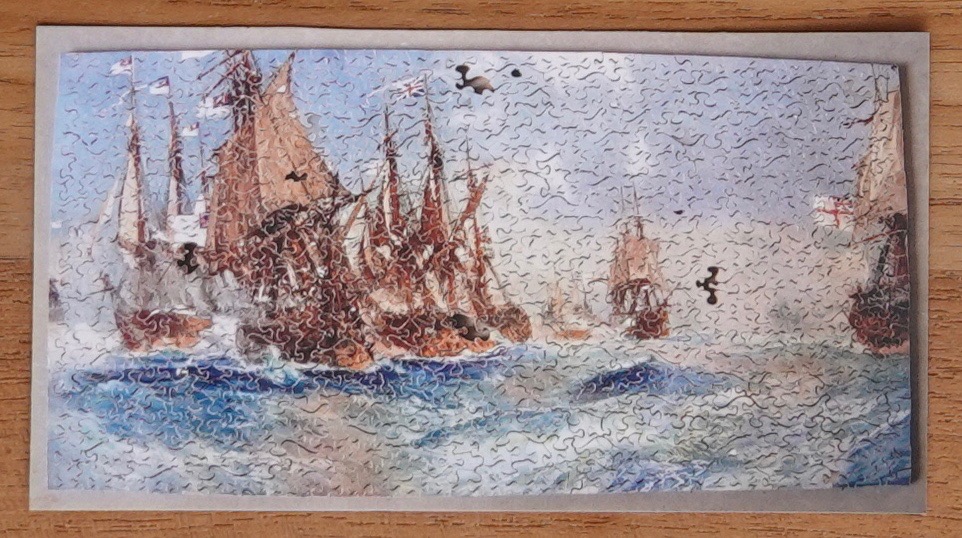 A maritime scene featuring a cluster of historic wooden sailing ships in a rough, choppy sea.