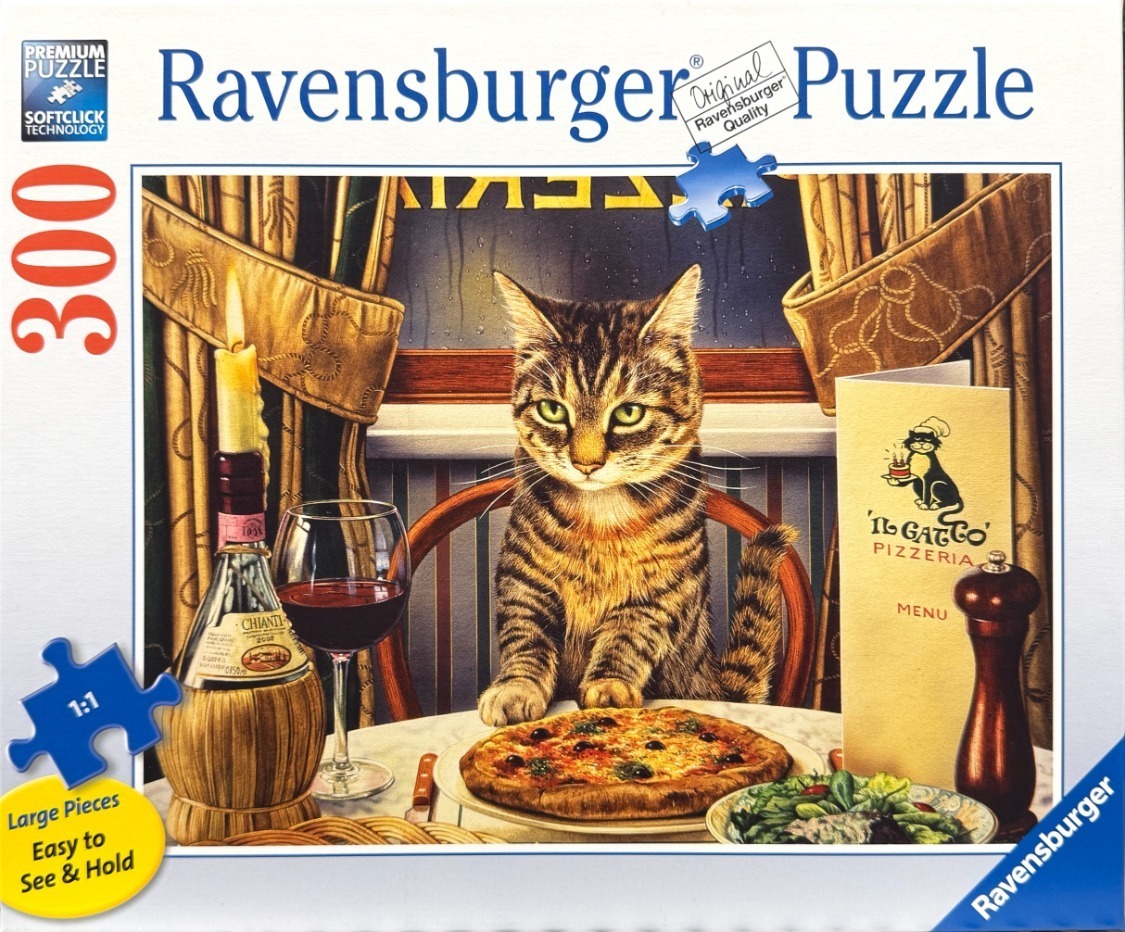 A tabby cat sits at a restaurant table with a pizza, a glass of wine, and a menu titled Il Gatto Pizzeria.