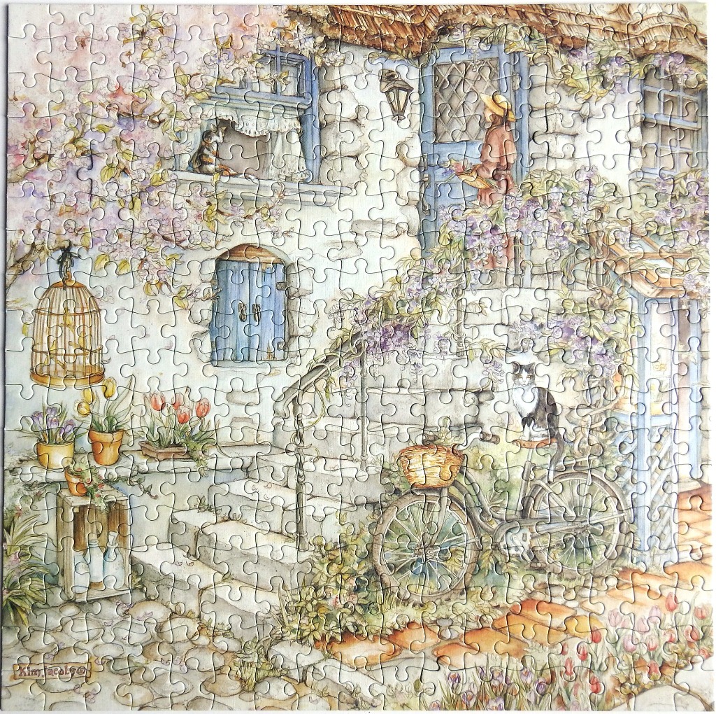 A whimsical illustration of a stone cottage exterior with a bicycle, cats, and climbing wisteria.
