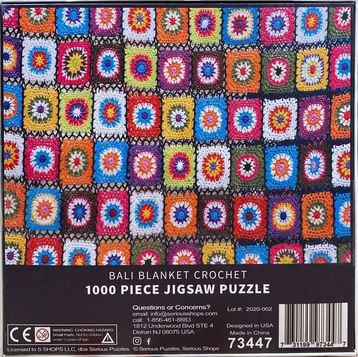 Colorful crochet granny squares in a vibrant, repeating pattern.