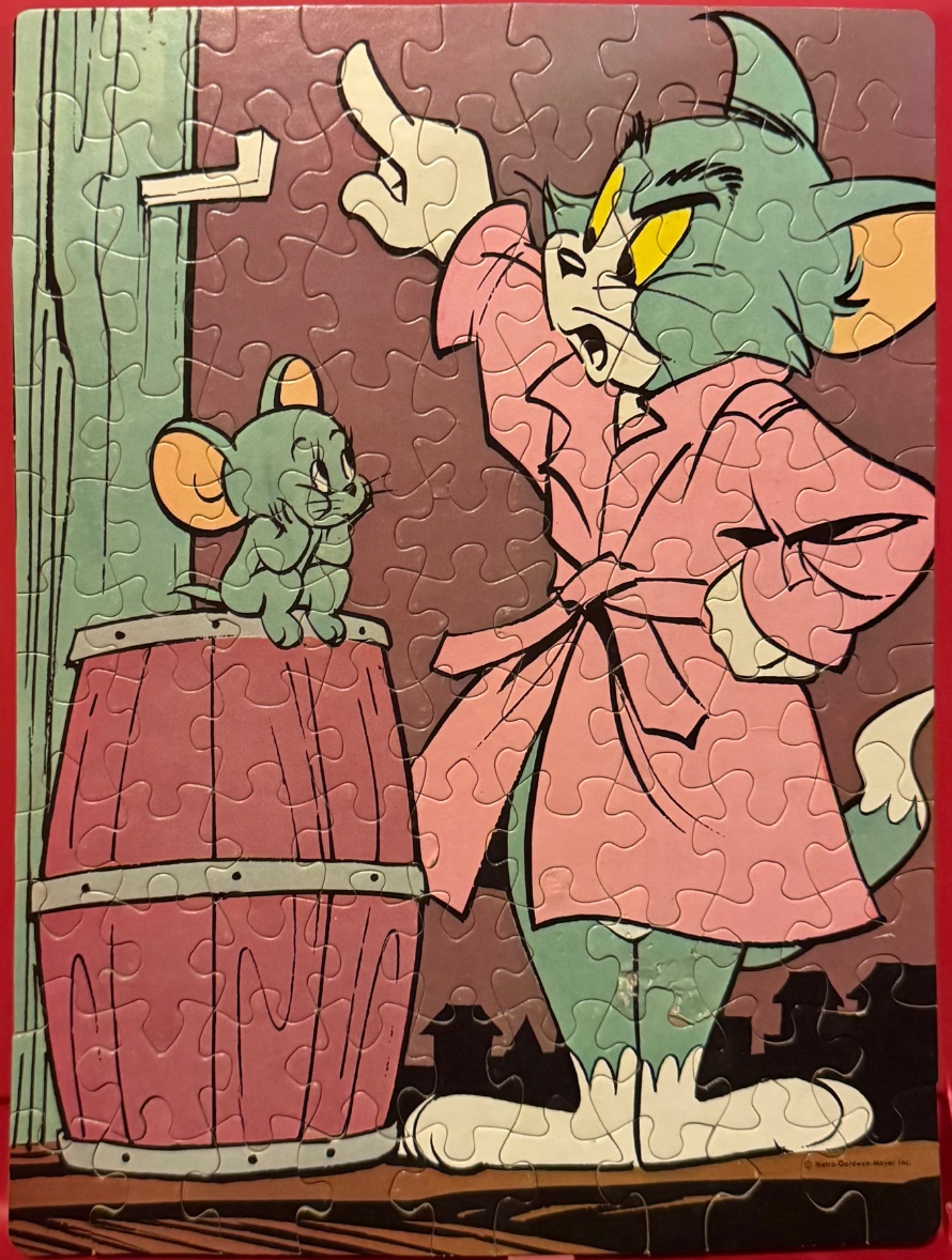 A vintage cartoon illustration of Tom the cat wearing a pink robe scolding a small mouse perched on a wooden barrel.