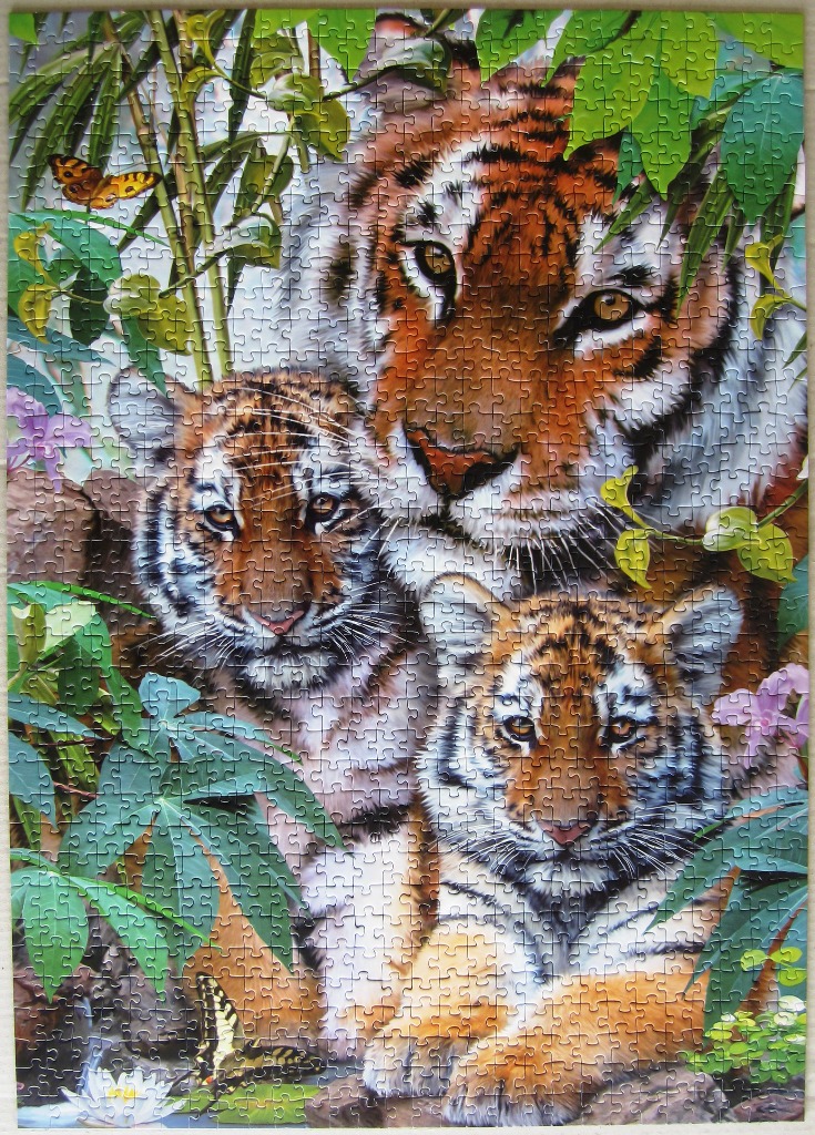 A mother tiger with two cubs nestled in a lush, green jungle environment with butterflies and white flowers.