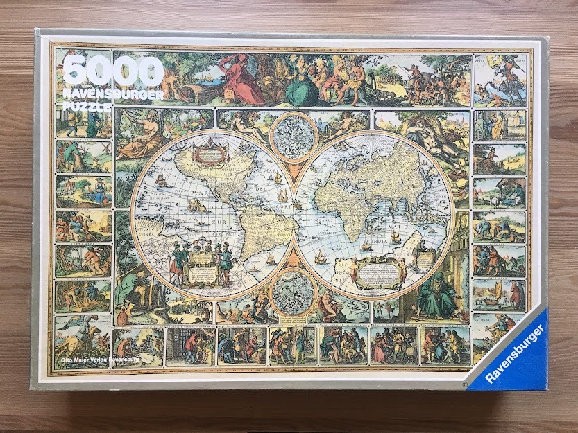A vintage-style world map surrounded by illustrations representing the four seasons, elements, and various cultures.