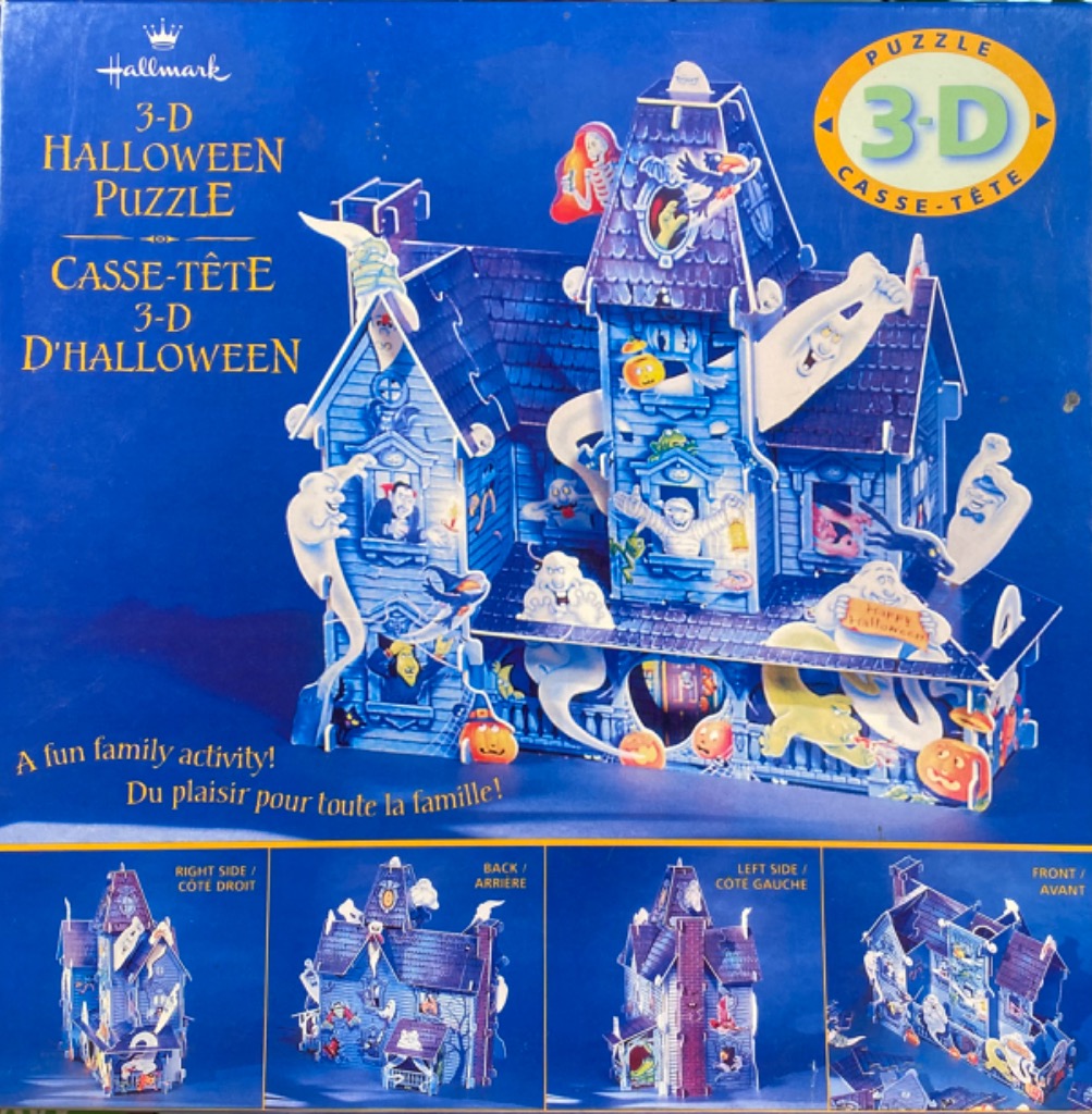 A 3D haunted house model decorated with ghosts, skeletons, and jack-o'-lanterns against a dark blue background.