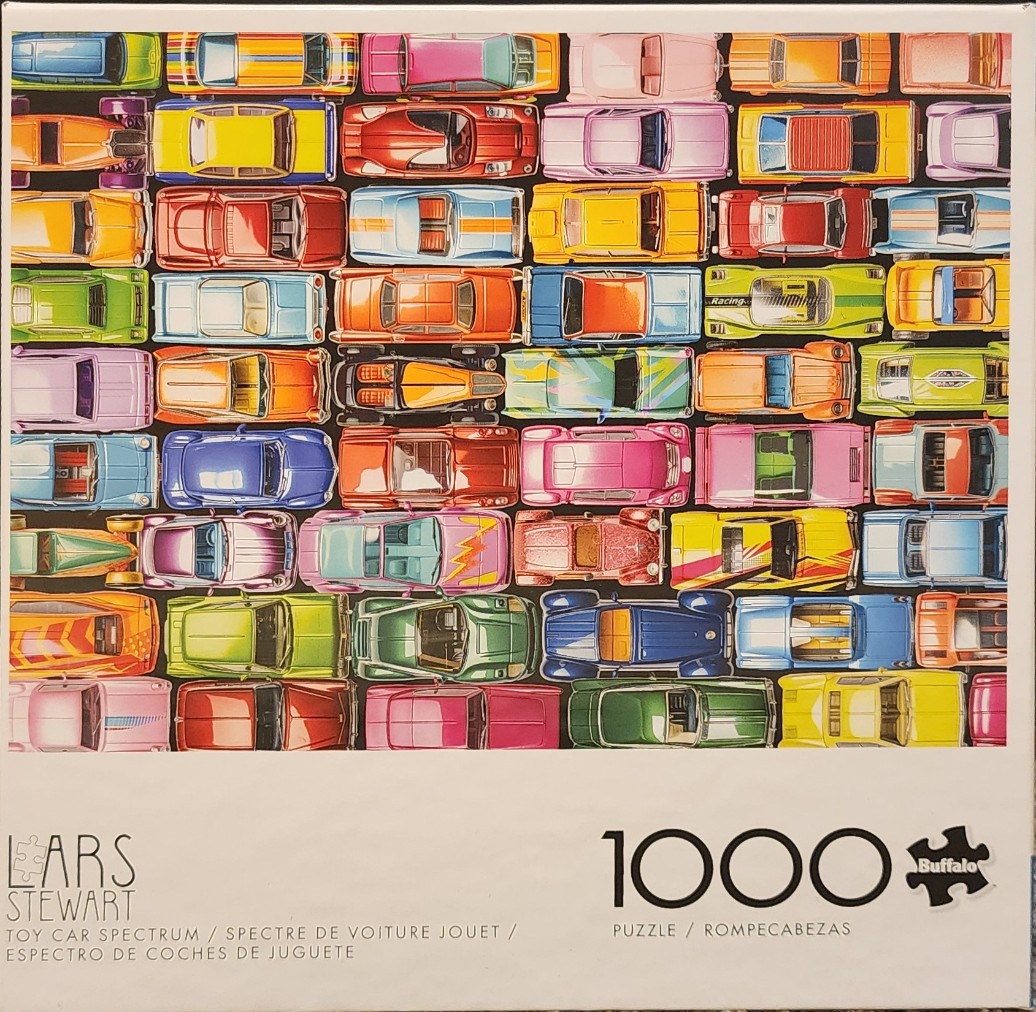 A top-down grid of colorful toy cars in many different styles and hues.