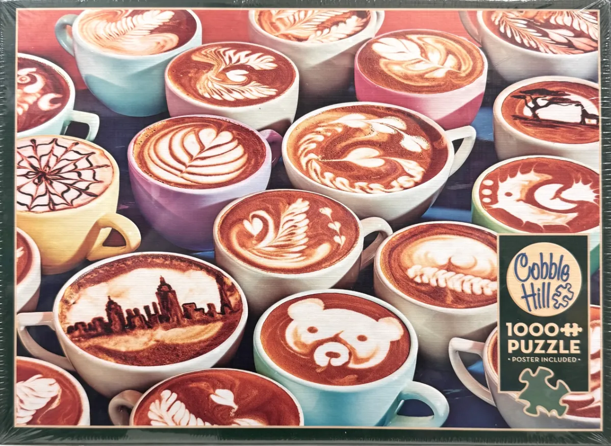A top-down view of many ceramic mugs filled with lattes featuring various artistic foam designs.