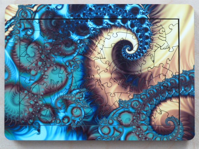 A fractal-based abstract art piece featuring swirls of blue, gold, and deep brown tones.