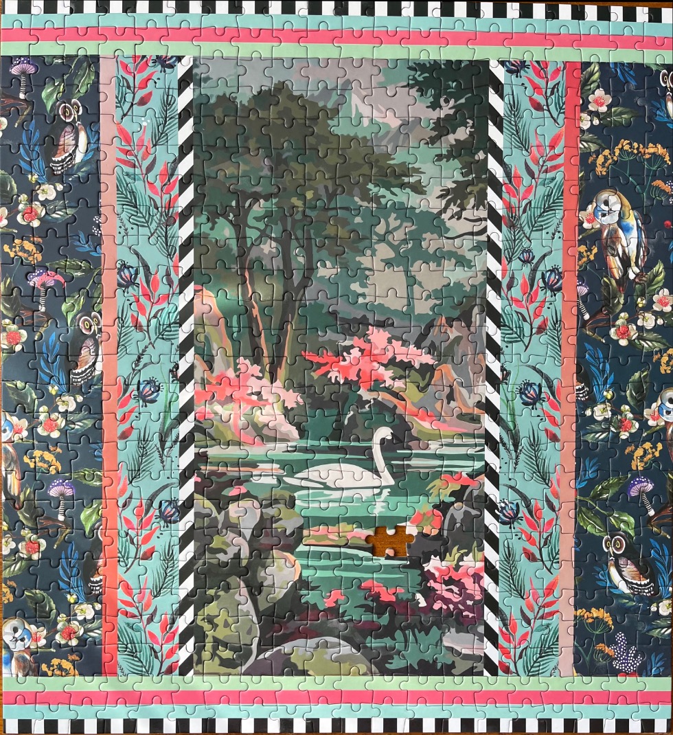 A swan swimming in a forest pond, framed by vertical floral and bird-patterned decorative panels.